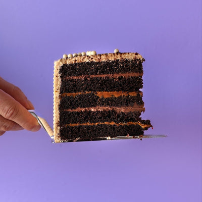 Chocolate Dulce de Leche Cake Slice  | dbakers Sweet Studio — available for same-day pickup at dbakers Midtown Miami